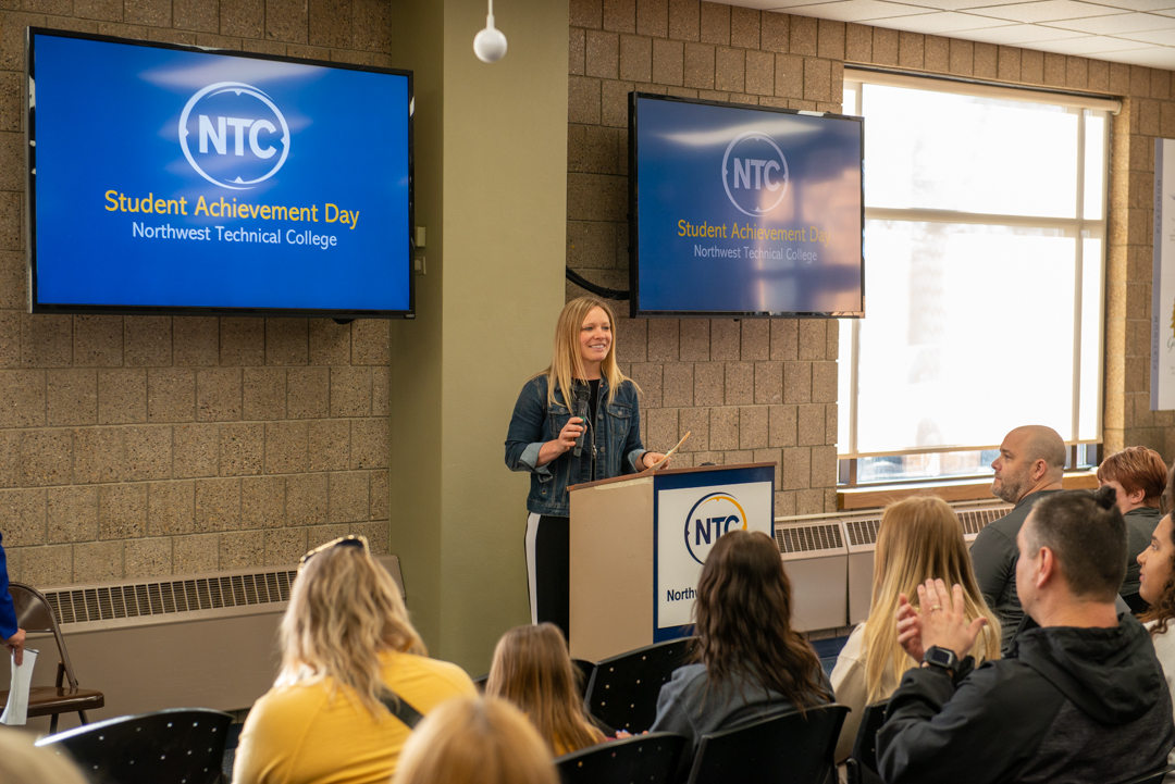 Leah Girard, interim student success center director, speaks at the Student Achievement Day April 18.
