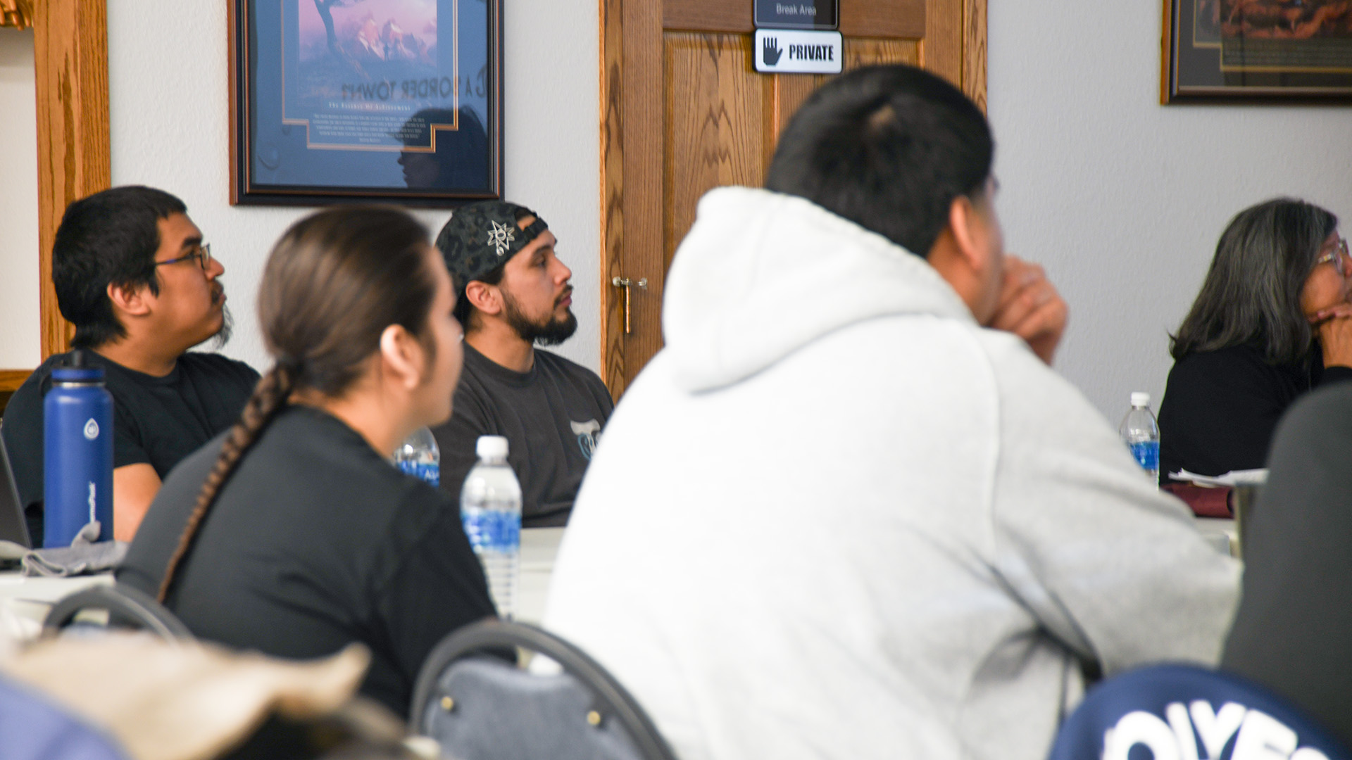 Four Wells Academy students watch a presentation during a training session at Wells Technologies.