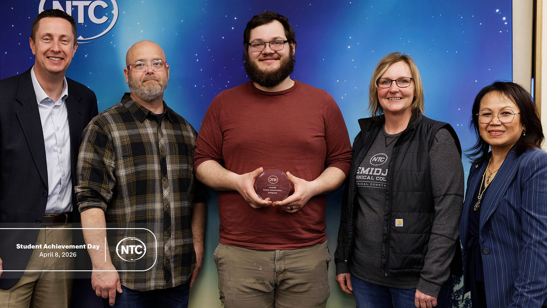 An NTC student with his Student Achievement Day award.