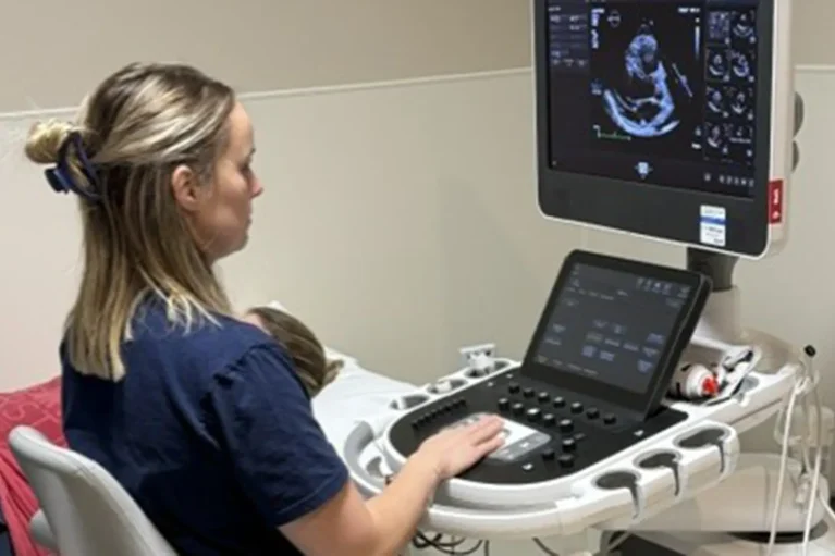 A sonographer taking a reading of someone's heart.