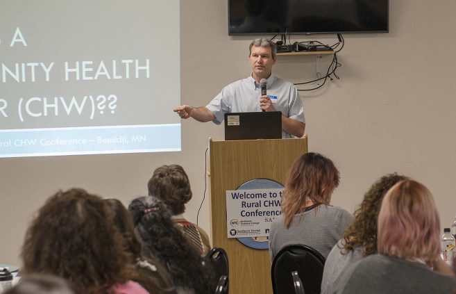 Darrin Strosahl, NTC vice president for academic affairs, speaks during the conference's opening presentation.