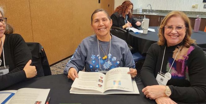 Three people at a table.