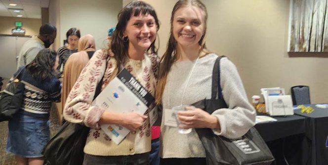 Two people posing for the camera.