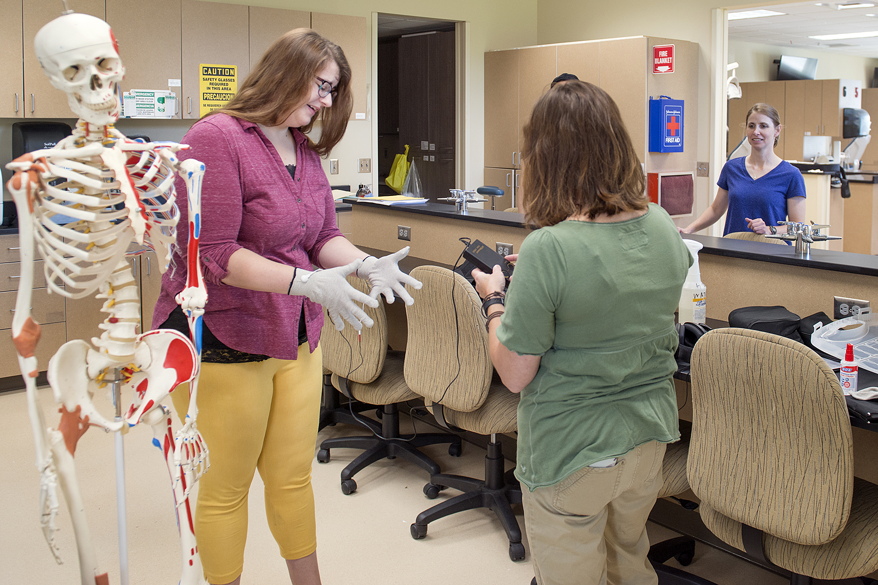 NTC Community members testing age simulation equipment