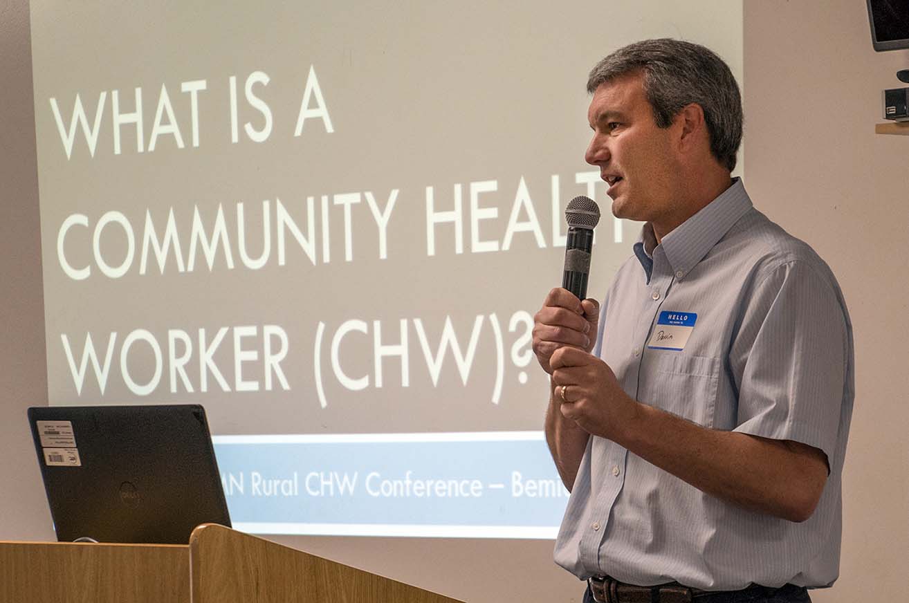 Darrin Strosahl, NTC vice president for academic affairs, speaks during the conference's opening presentation.