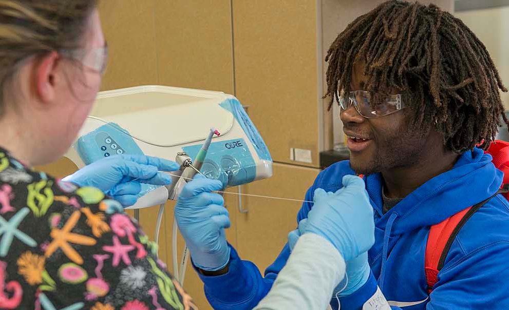 A student explores Dental Assisting at NTC's March 21 Passport to the Future event.