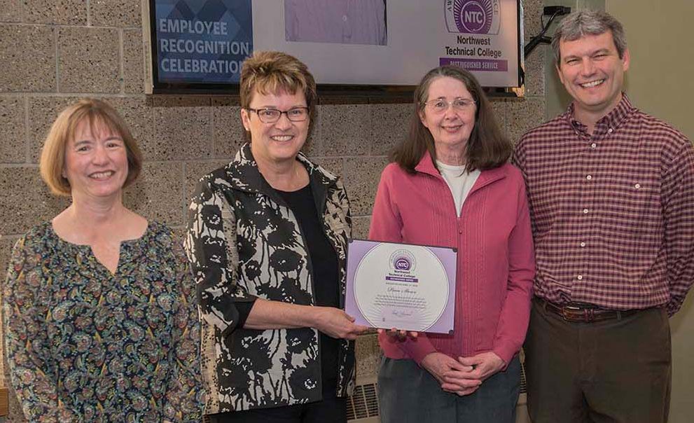 Pam Stowe (2nd from right) won NTC's Distinguished Service Award and was recognized for her upcoming retirement after 20 years of service. She's pictured with VP Karen Snorek (left), President Faith Hensrud and VP Darrin Strosahl.