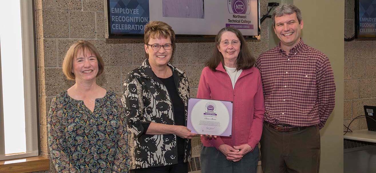 Pam Stowe (2nd from right) won NTC's Distinguished Service Award and was recognized for her upcoming retirement after 20 years of service. She's pictured with VP Karen Snorek (left), President Faith Hensrud and VP Darrin Strosahl.