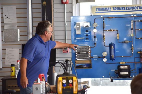 Jeff Brower, unlimited full-time faculty in plumbing, led an introduction to NTC's new Commercial Refrigeration/HVAC program to more than a half-dozen prospective students July 23 at the college's Sustainable Energy Technology Center.