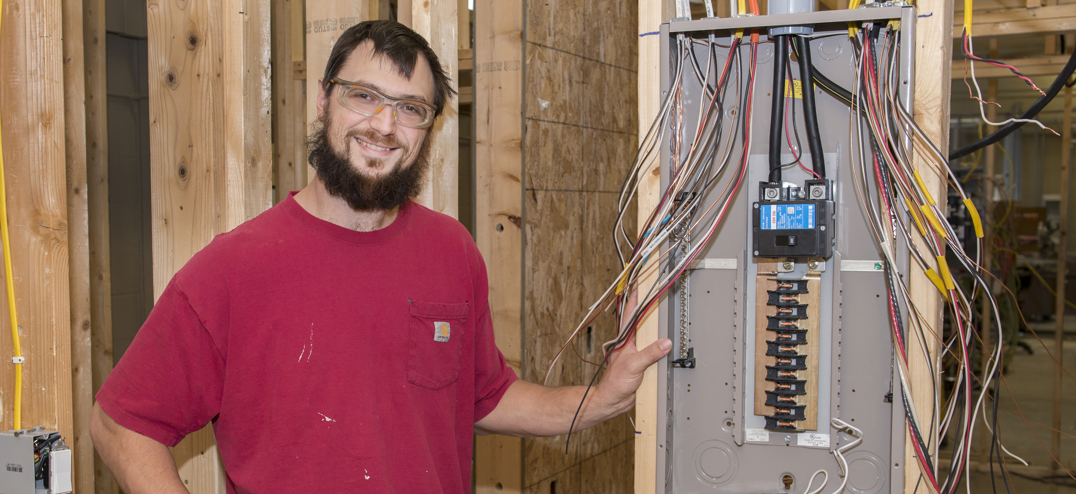 Shawn Graupmann standing next to an electrical box