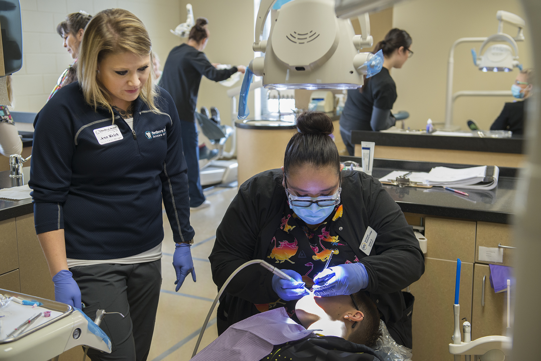 NTC Dental Assistant conducting a dental screening.