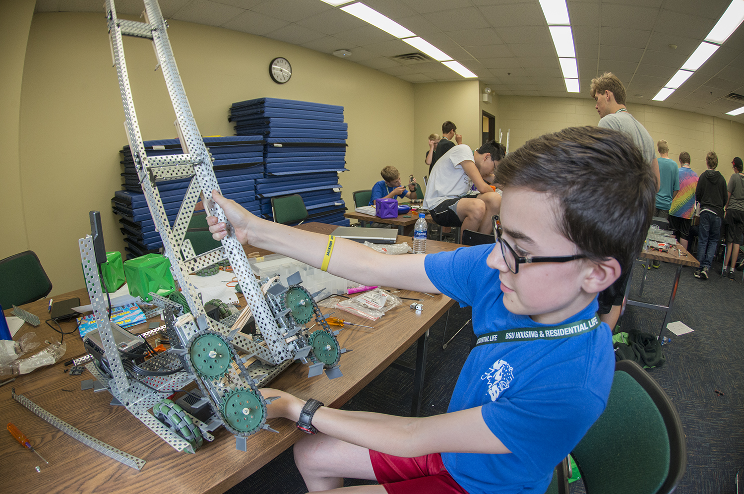 VEX Robotics camper working on robot