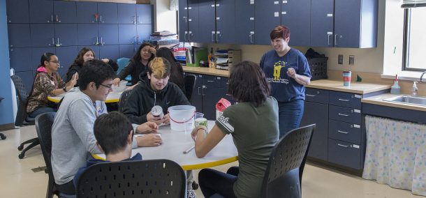 Heather Sutherland, early childhood education faculty, working with high school students.