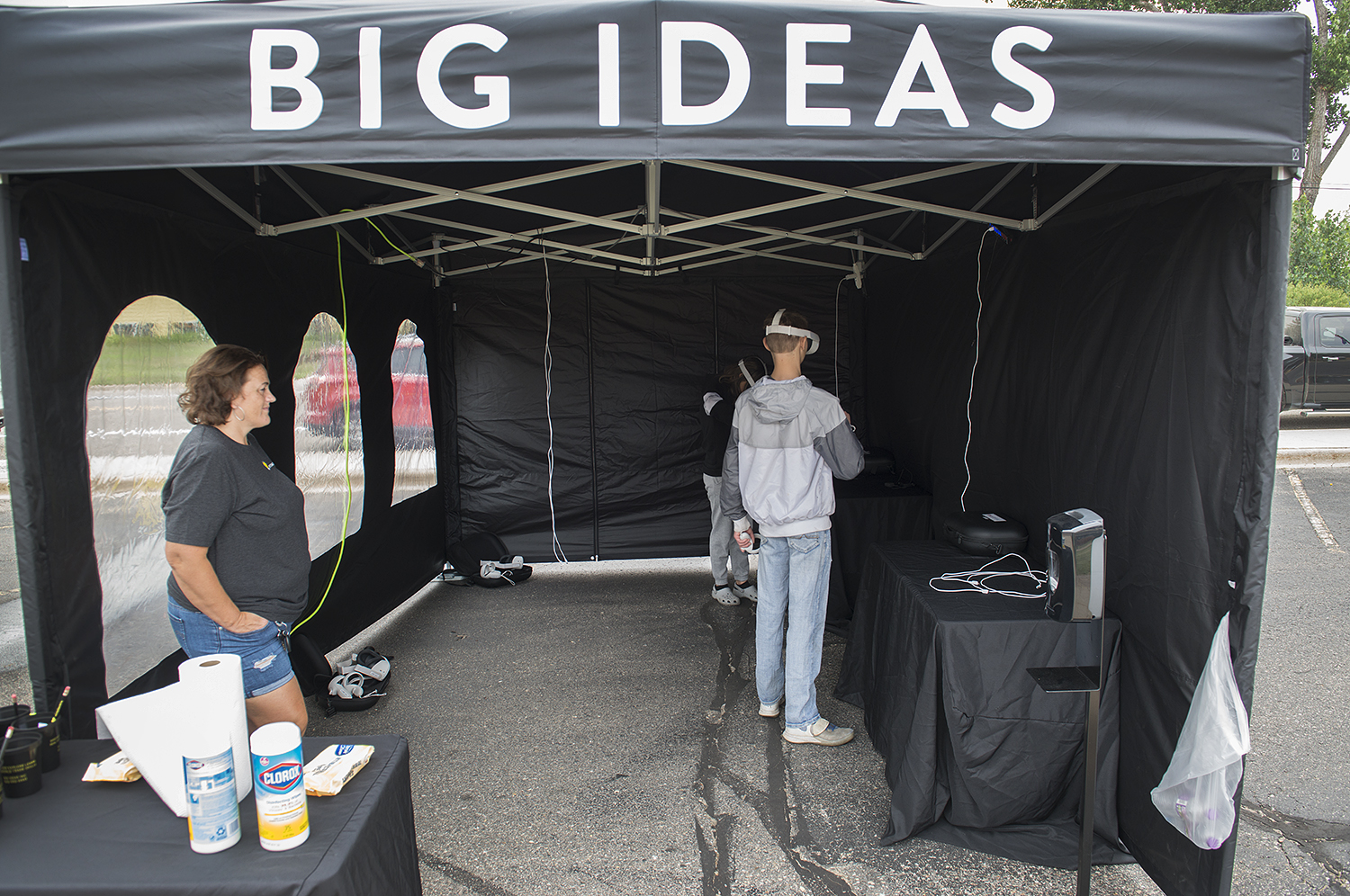 Attendees using equipment at the Big Ideas Road Show event.