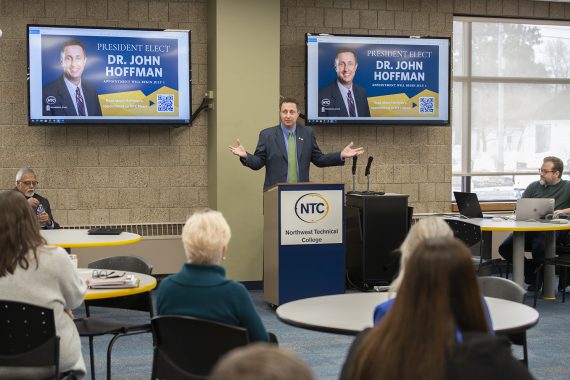 President Designate Hoffman speaks to onlookers on campus