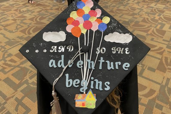 Northwest Tech Class of 2022 graduation cap that says "And so the adventure begins"