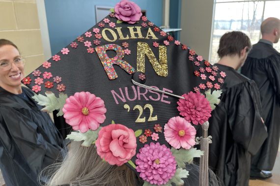 Northwest Tech Class of 2022 graduation cap that says "Olha RN Nurse '22"