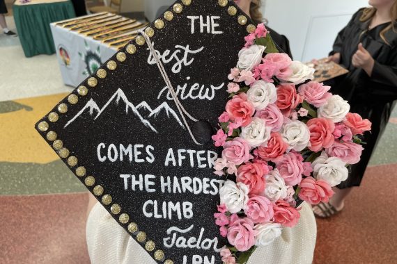Northwest Tech Class of 2022 graduation cap that says "The best view comes after the hardest climb"