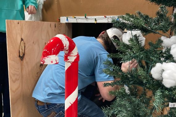 An NTC student helps construct a float for the Night We Light Parade in downtown Bemidji on Nov. 25