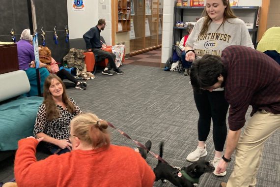 NTC students play with dogs and cats during the college's de-stress with pets event on Dec. 13