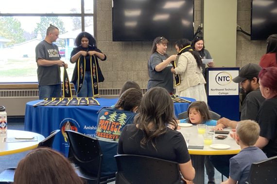 An NTC student is presented with her stole