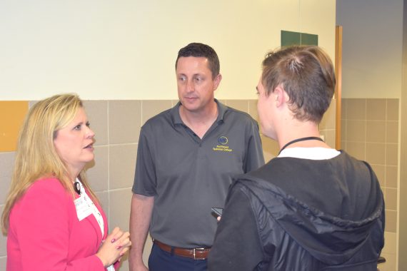 Dr. John L. Hoffman (center) and Sanford Health President and CEO Karla Eischens (left) speak with Daltyn Lofstrom from the Bemidji Pioneer.