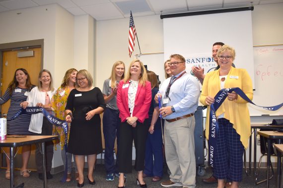 Representatives from NTC, Bemidji High School and Sanford Health unveil the Sanford/NTC Health Sciences Lab for CNA students at Bemidji High School.